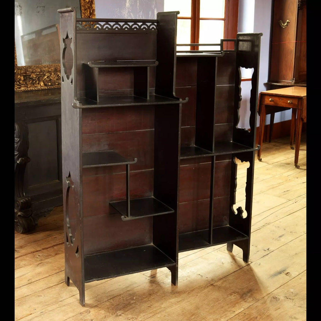 Japanese style open display shelves in dark lacquered wood with intricate cutout details by Collection EE40
