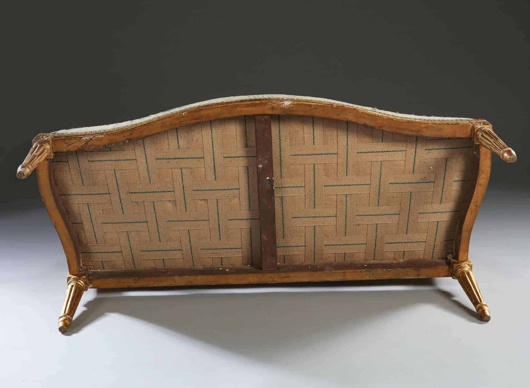 Underside view of a refined 18th-century Neo Classical canapé by Collection CK20 with carved giltwood frame