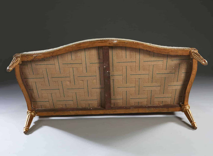 Underside view of a refined 18th-century Neo Classical canapé by Collection CK20 with carved giltwood frame