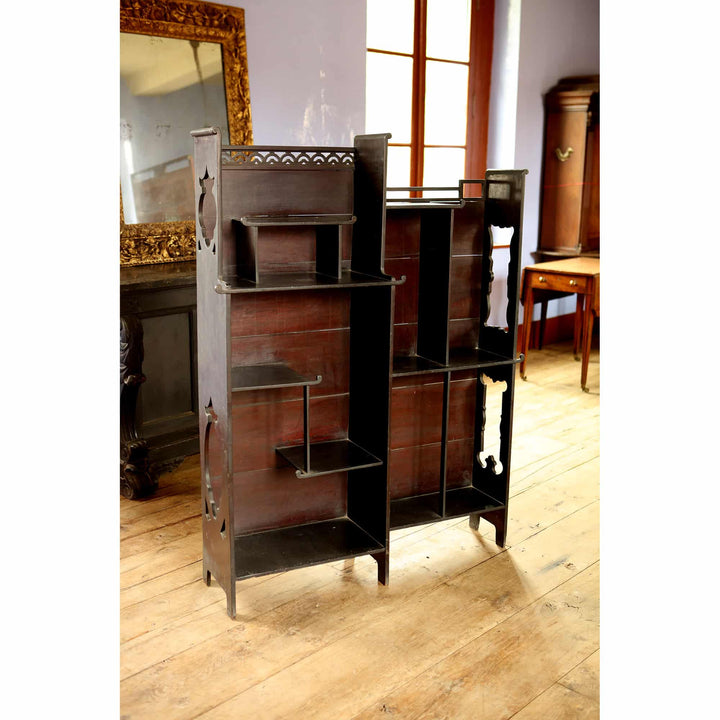 Japanese style open display shelves with intricate cut-out details by Collection EE40 in a bright vintage room