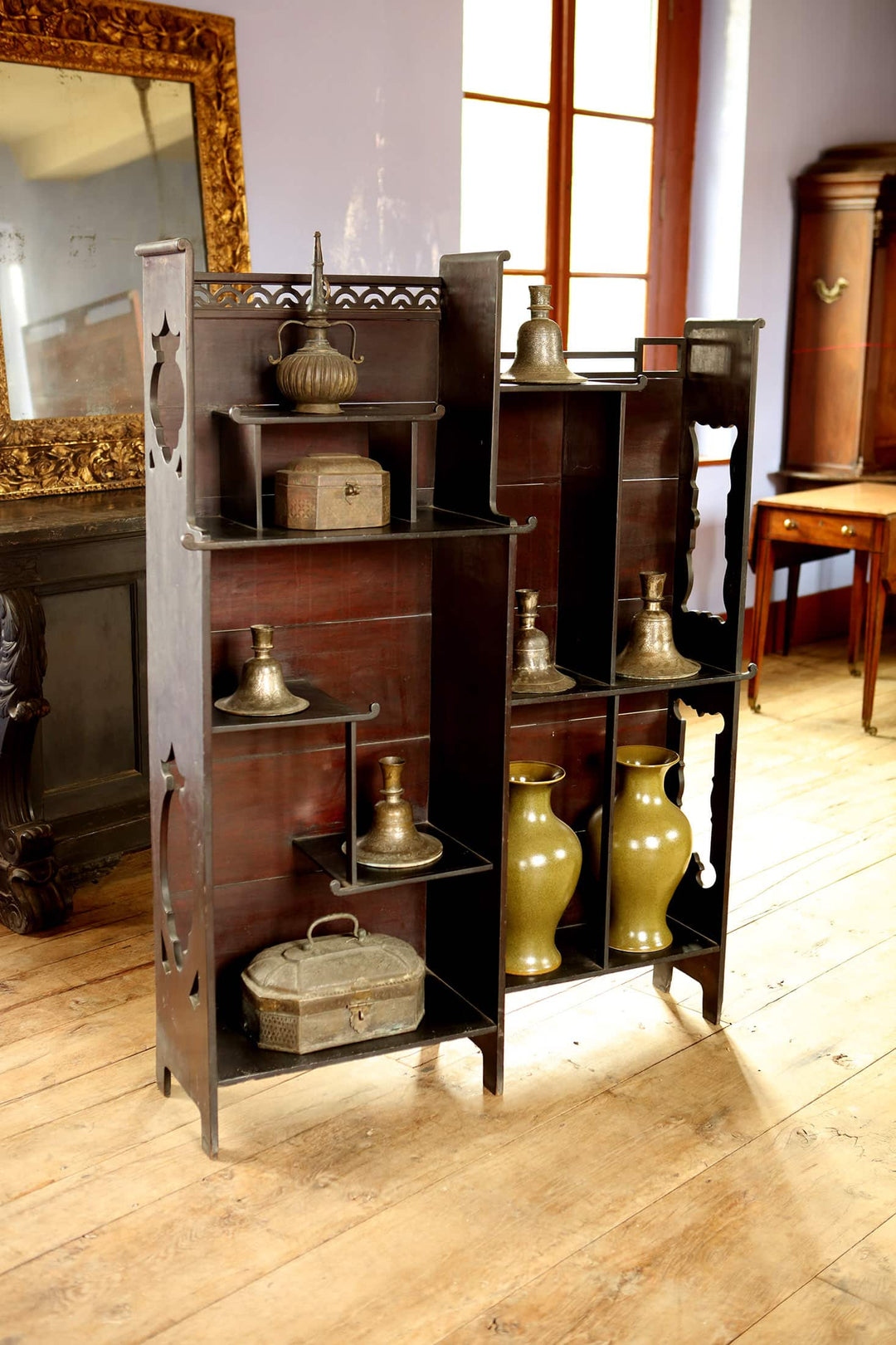 Collection EE40 Japanese style open display shelves with lacquered wood and intricate curved designs in a classic room setting