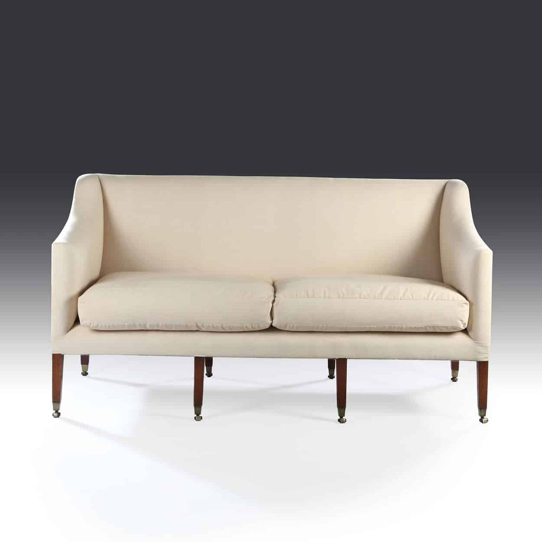 George III flat back mahogany sofa with off-white linen upholstery and brass-tipped legs by The Sold Archive