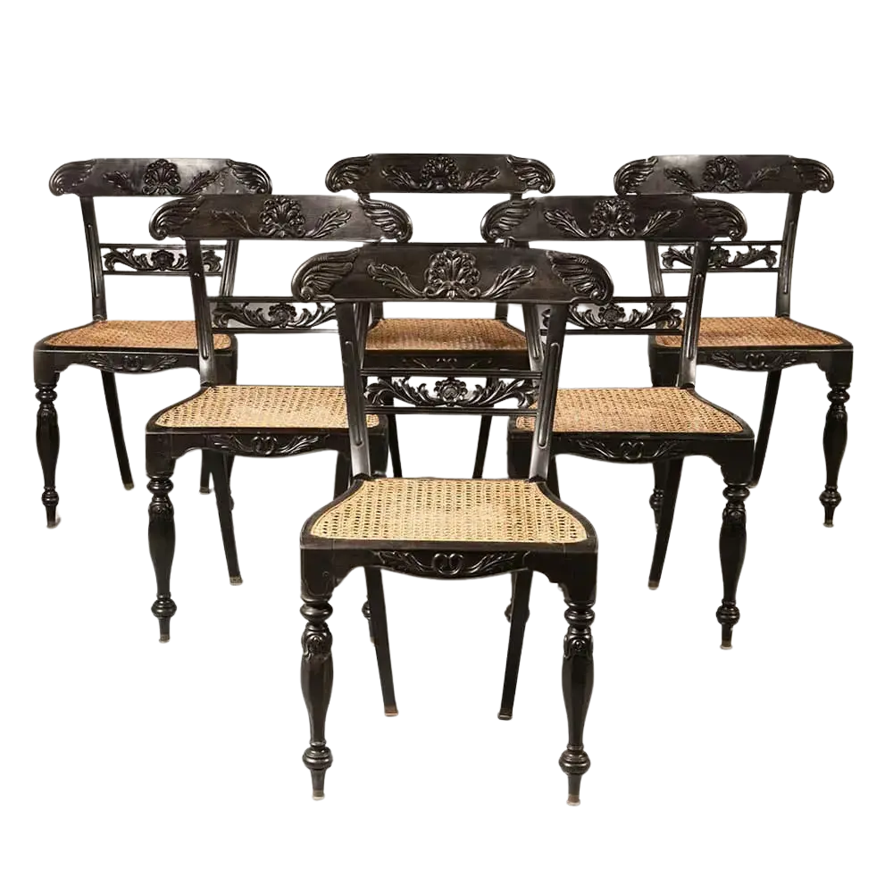 Set of six Anglo Indian ebony side chairs with caned seats and carved details by Collection EE30