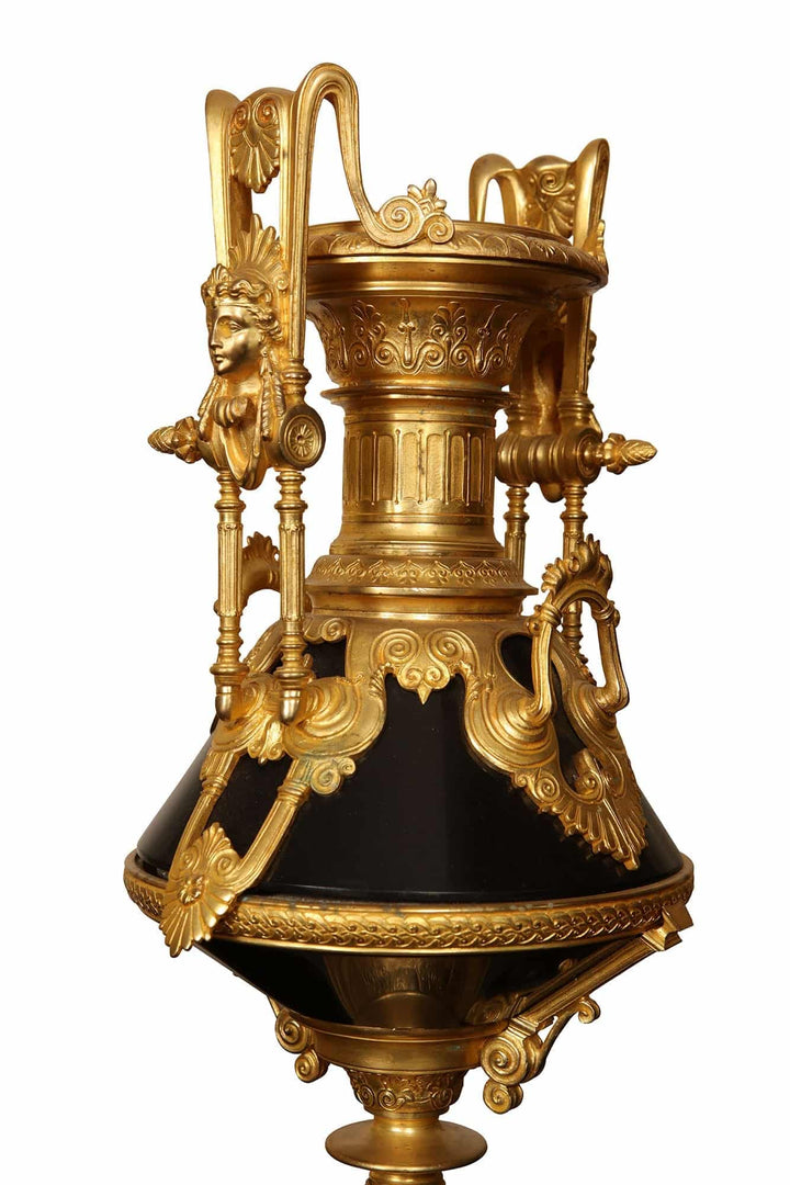Ornate gilt bronze urn with neo-classical busts and detailed black marble base by Nicholas Wells Antiques