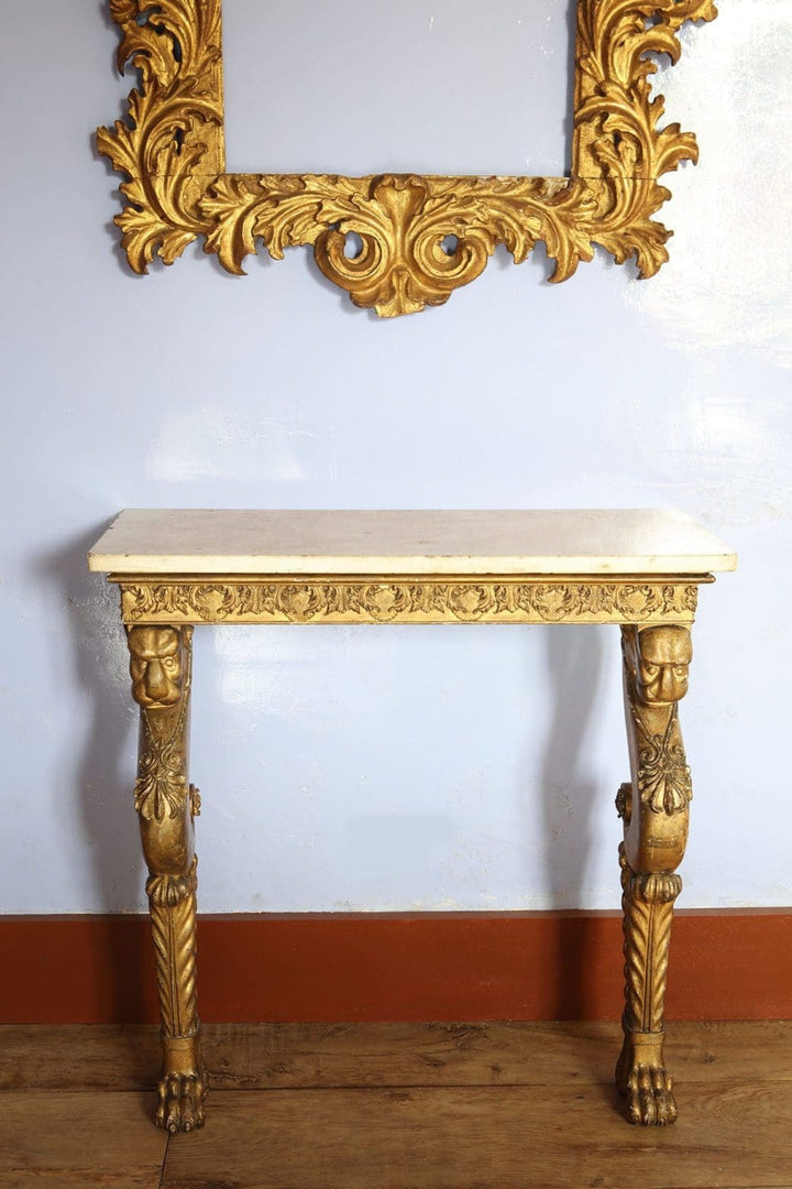 Regency Giltwood Console Table After the Antique with white marble top and giltwood chimera legs circa 1810 England.