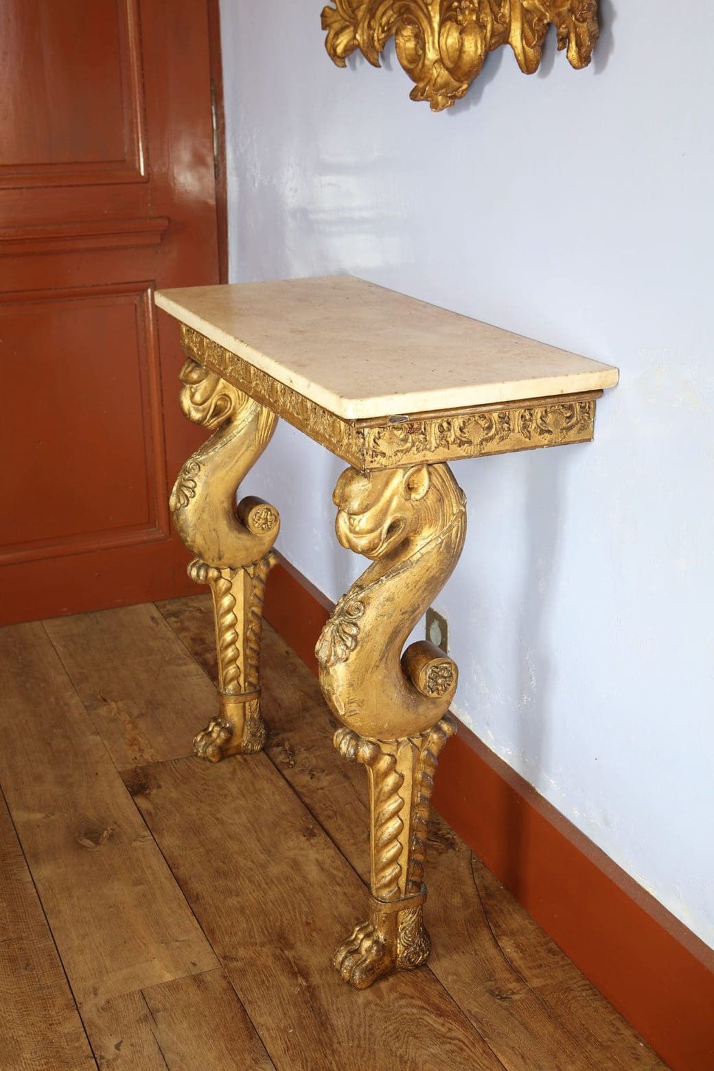Regency Giltwood Console Table After the Antique with white marble top and giltwood chimera legs circa 1810 England.