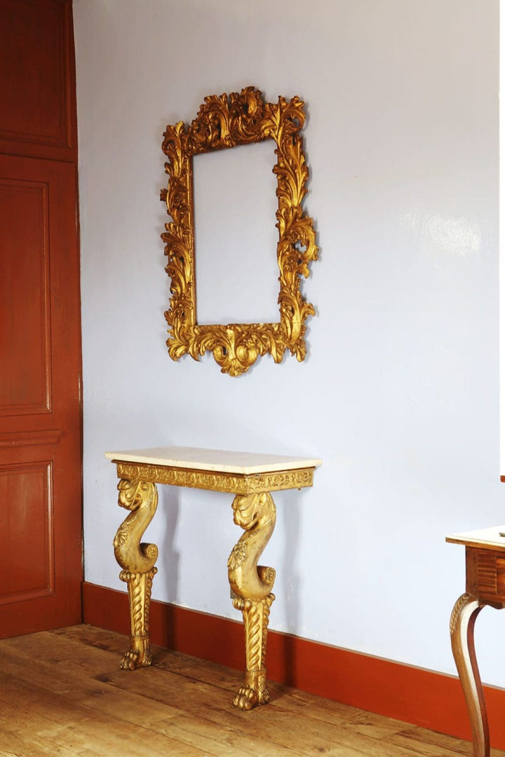 Regency Giltwood Console Table After the Antique with white marble top and gilt chimera legs circa 1810 England.