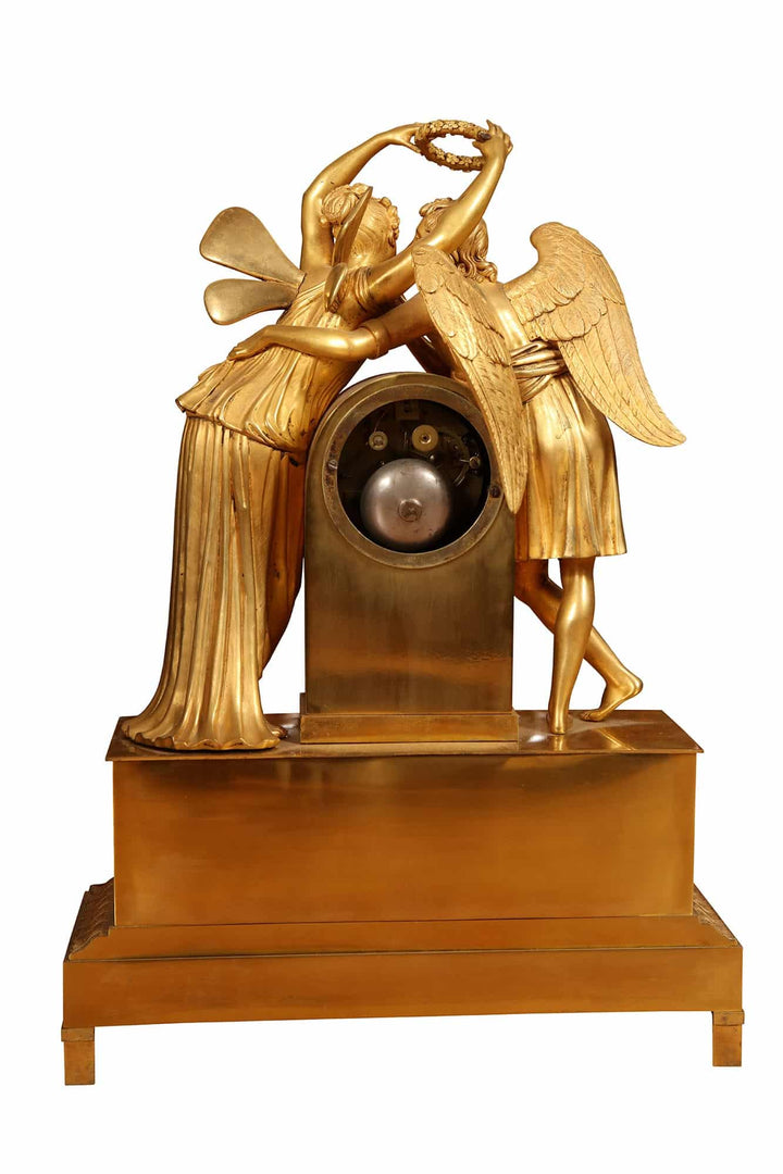 Early 19th century gilt bronze mantel clock with Cupid and Psyche, Nwtiques, France circa 1820