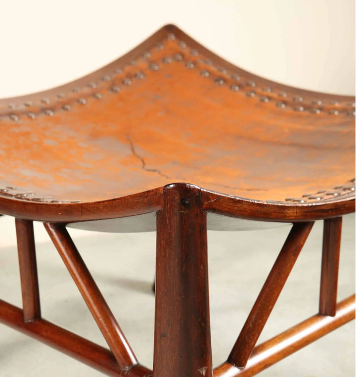 Close-up of a vintage Liberty & Co. Thebes stool with turned beechwood legs by Collection TH20