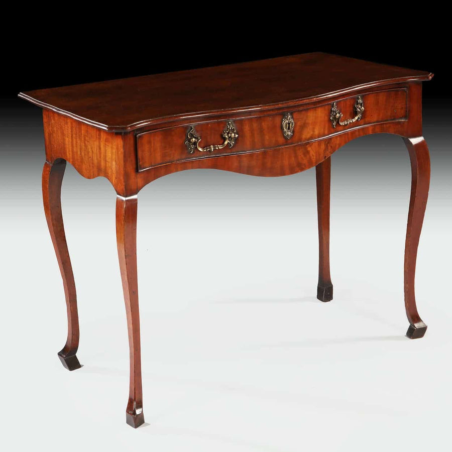 Elegant George III mahogany Chippendale side table with serpentine front and brass handles by The Sold Archive