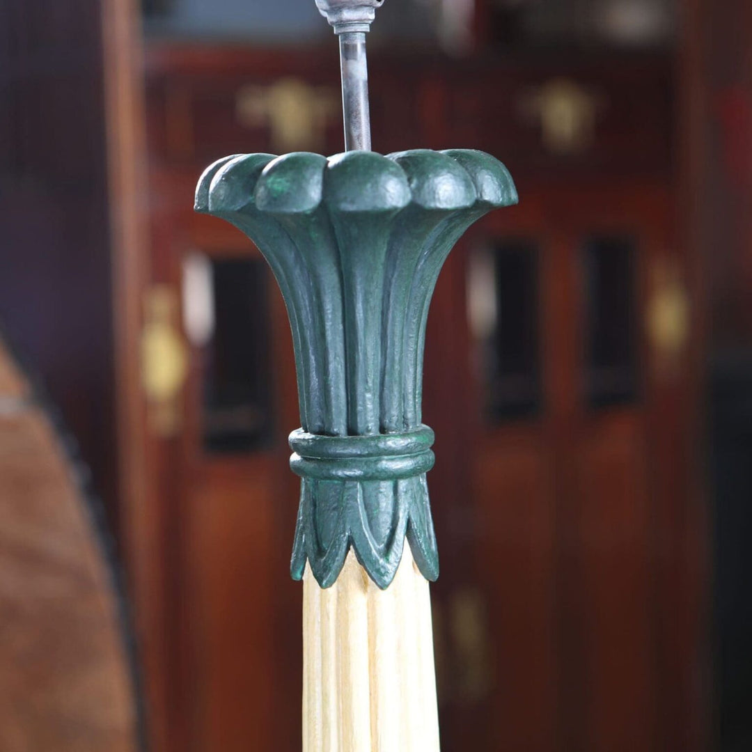 Pair of Foliate Column Lamps with cream lacquered columns and dark green bases, raised on polished brass ball feet.