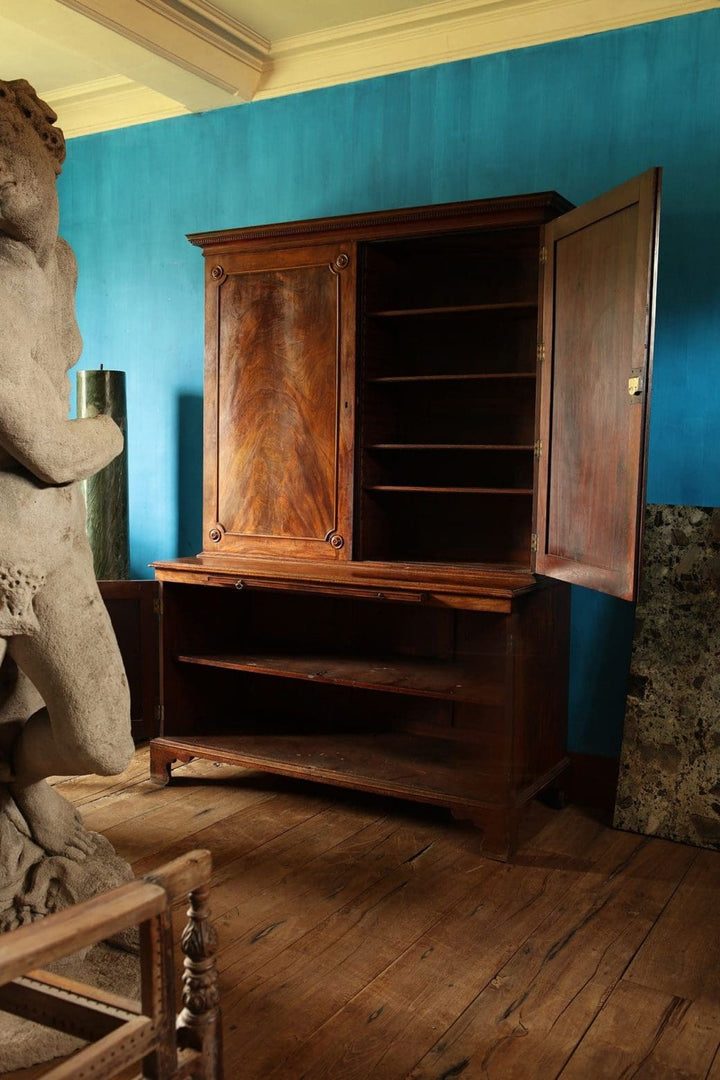 Magnificent George III estate cabinet in flame mahogany with open shelves, by Collection EE40, set against turquoise wall