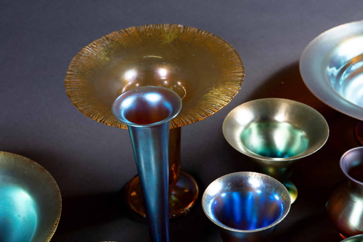Collection TH20 Art Deco iridescent glass bowls and vases with elegant shapes and radiant colors from WMF Myra series