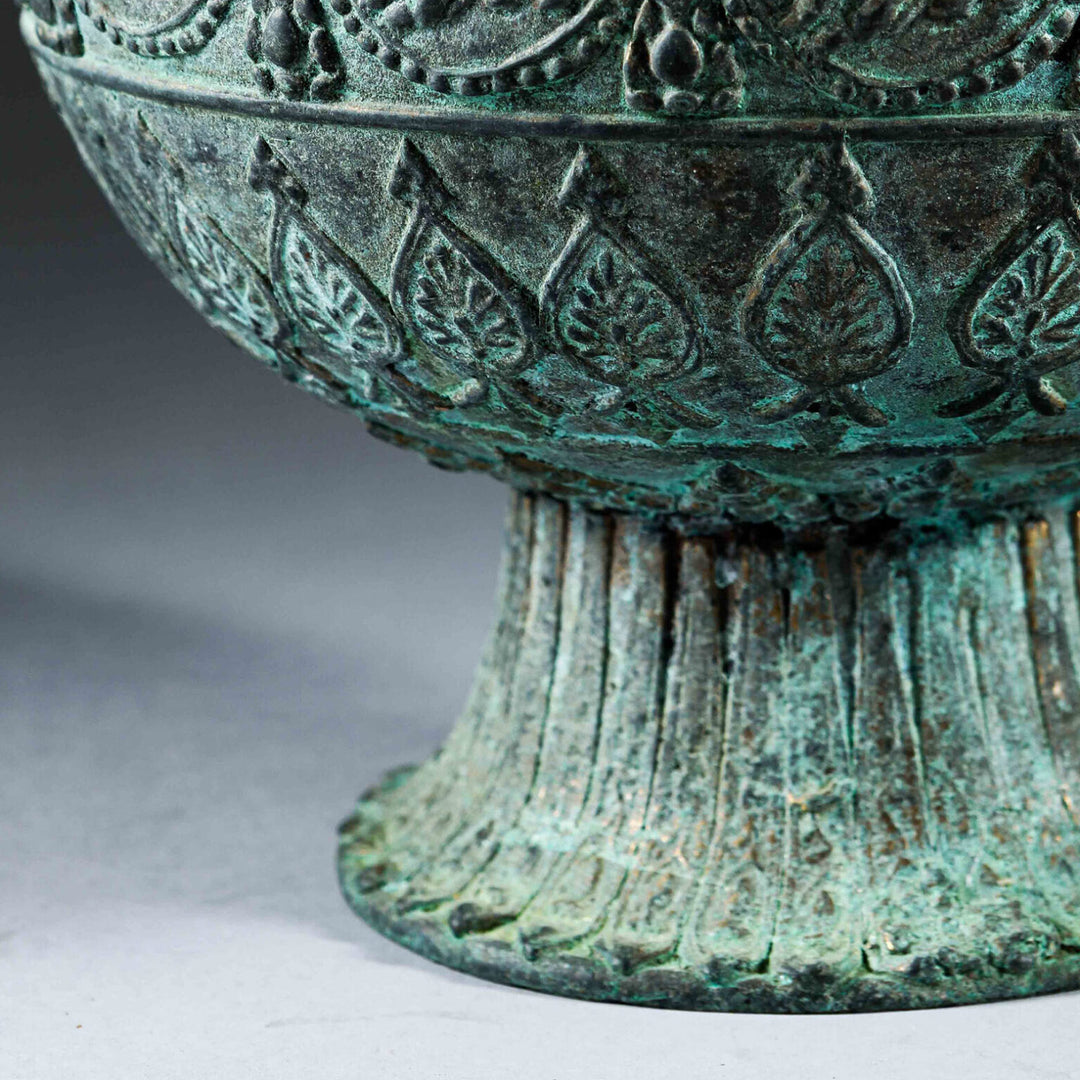 Indian Bronze Vase as a Table Lamp showing detailed embossed leaf and floral patterns on a flared foot base.