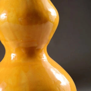 Pair of Yellow Double Gourd Vases as Lamps with glossy yellow glaze and bulbous double gourd shape on dark background