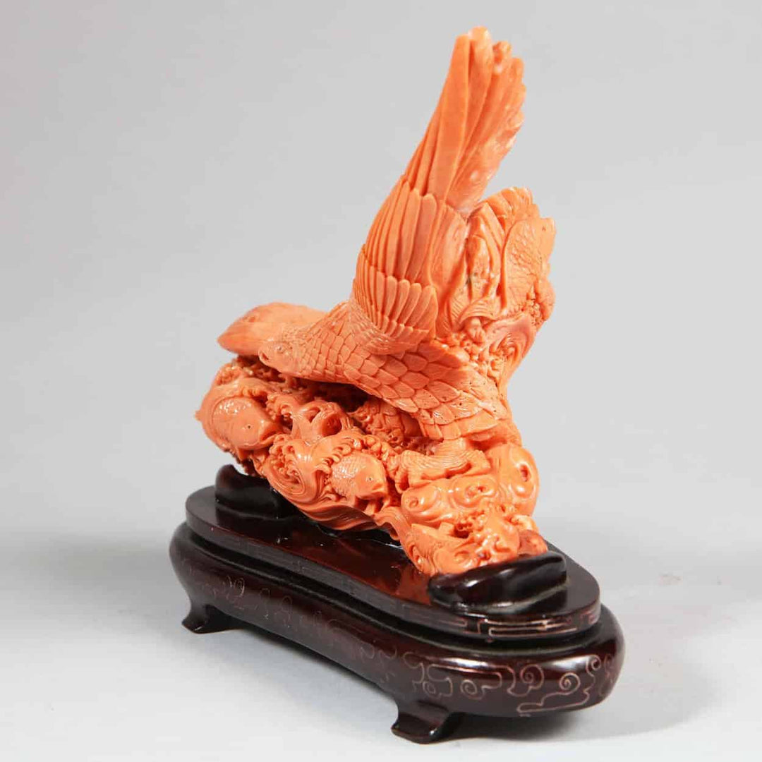 Intricately carved Japanese coral sculpture of a Steller’s Sea Eagle capturing a fish mounted on a wooden base by Nwtiques