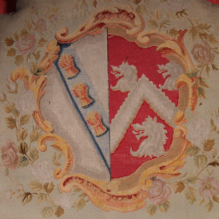 Close-up of hand-embroidered armorial needlework on a Pitchford Hall Dining Chair seat by Collection NE10