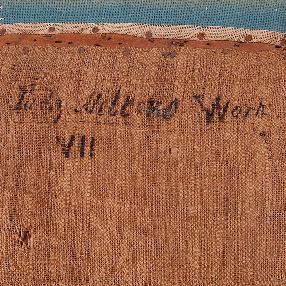 Close-up of original hand-embroidered needlework signed by Lady Milton on Pitchford Hall Dining Chair seat, Collection NE10.