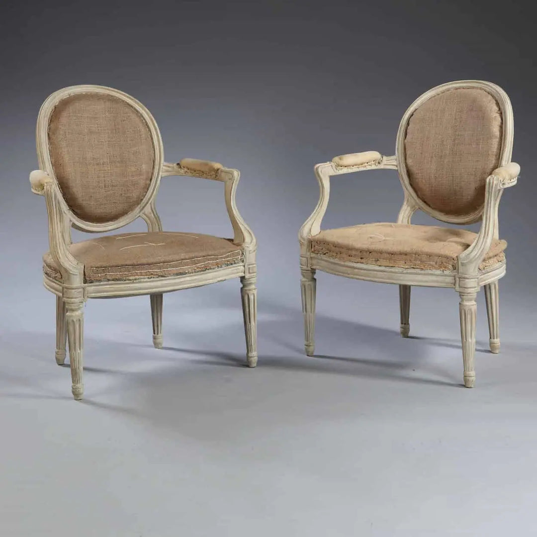 Pair of transitional Louis XV style fauteuils with oval backs by Nwtiques, circa 1870, finely detailed woodwork