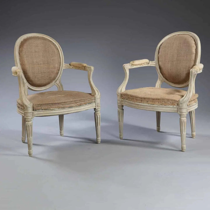 Pair of transitional Louis XV style fauteuils with oval backs by Nwtiques, circa 1870, finely detailed woodwork