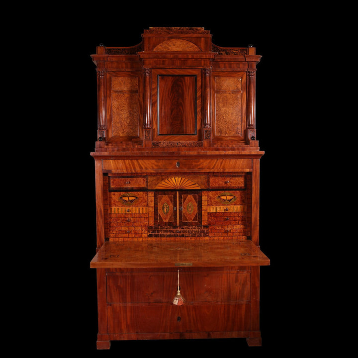 Biedermeier Secretaire abattant with flame mahogany veneers and fitted interior with hidden compartments, circa 1815.