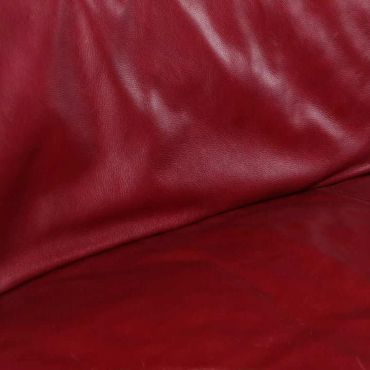 Close-up of maroon leather upholstery on a 20th Century red sofa from Collection NE10 with rich grain texture