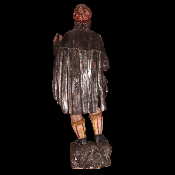 Baroque Venetian Court Figure in Polychrome & Silver Leaf showing rear view of 17th-century detailed sculpture.