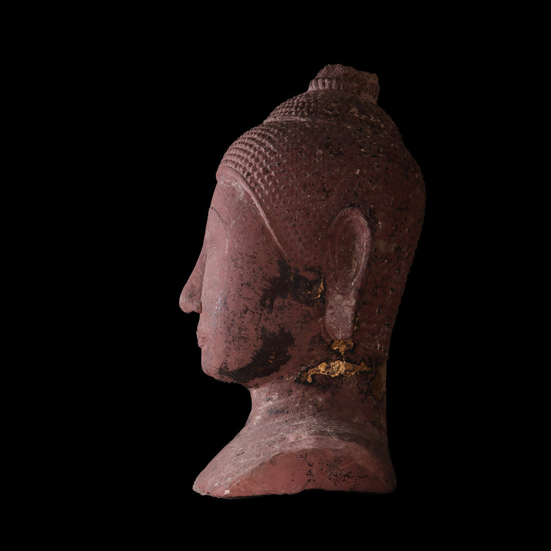 Side view of Ayutthayan Siamese red sandstone Buddha head with gilding remnants by Collection NE10