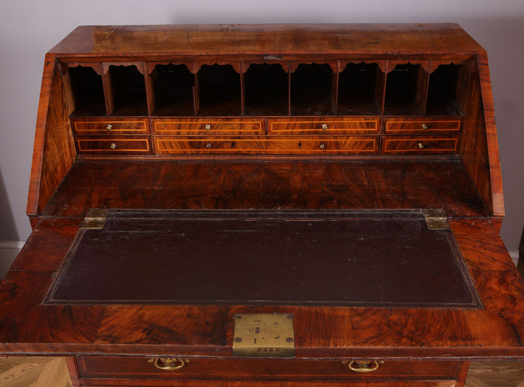 Early 18th Century Figured Walnut Bureau Cabinet with open fall front revealing fitted interior drawers and pigeon holes.