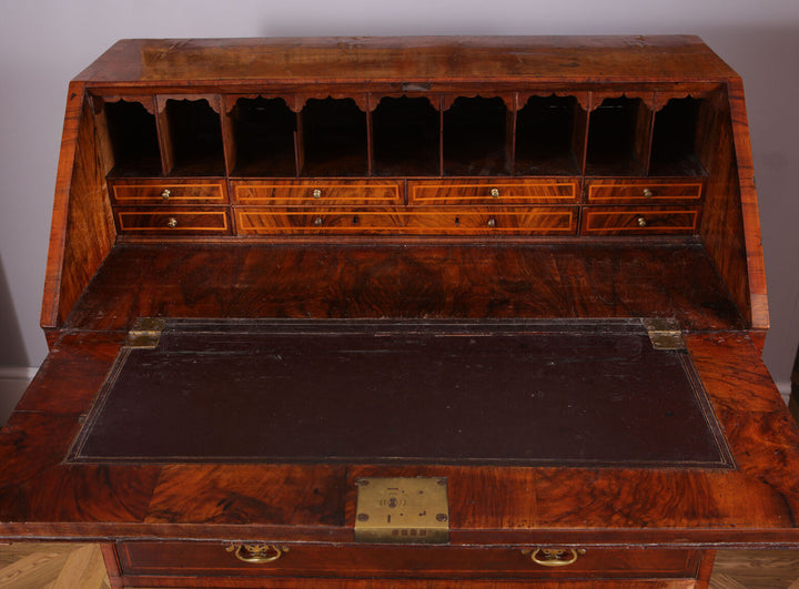 Early 18th Century Figured Walnut Bureau Cabinet with open fall front revealing fitted interior drawers and pigeon holes.
