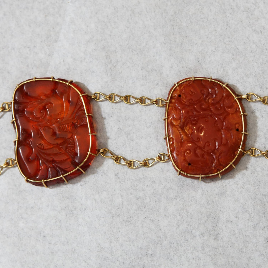 Chinese carved amber necklace with gold mountings by Nwtiques, showcasing traditional craftsmanship circa 1880.
