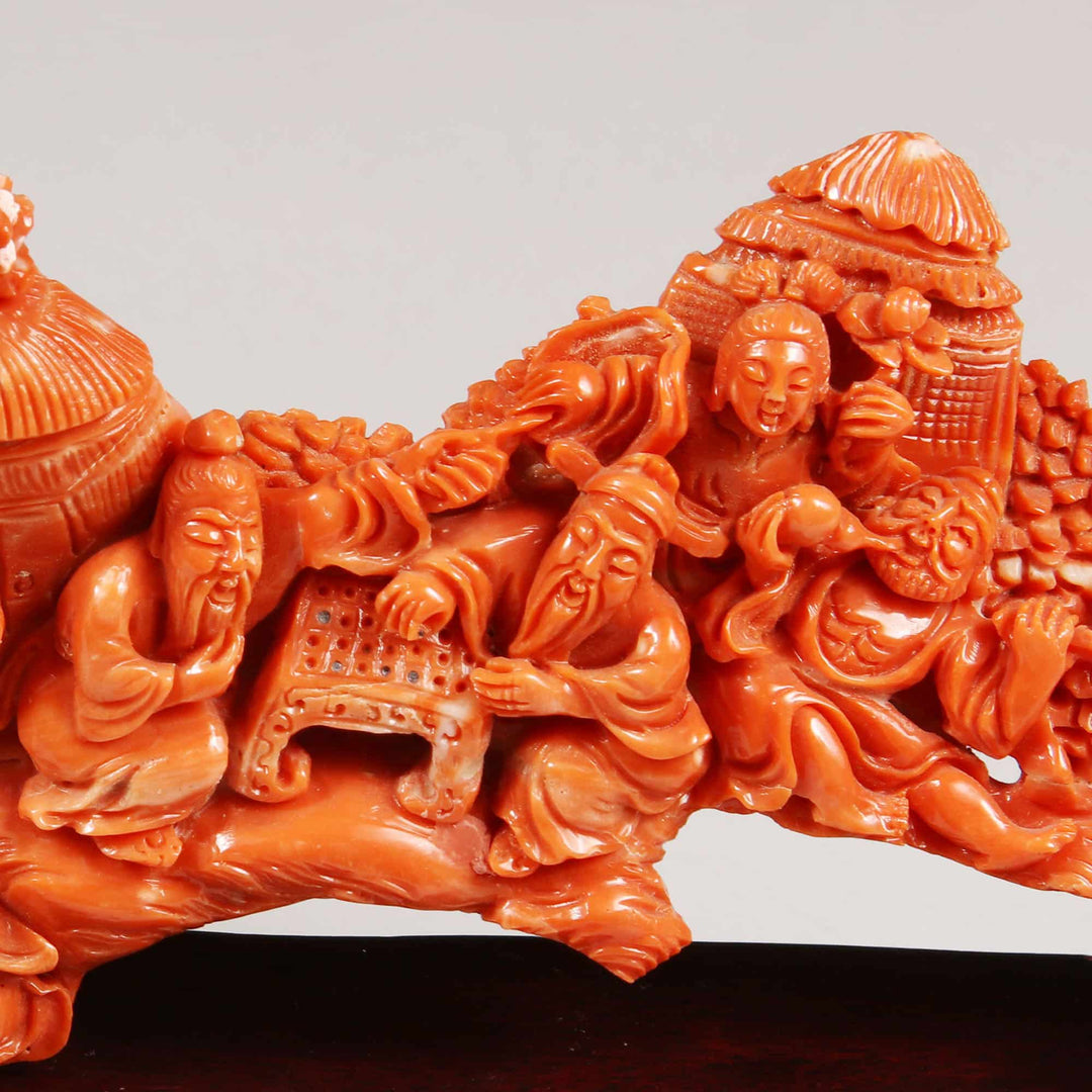 Chinese 20th century carved precious coral group by Nwtiques showing figures playing games and relaxing