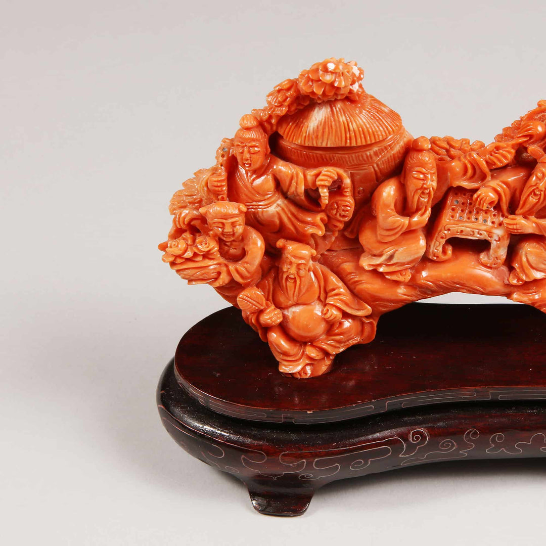 Chinese 20th century carved precious coral group showing figures relaxing, offered by Nwtiques.