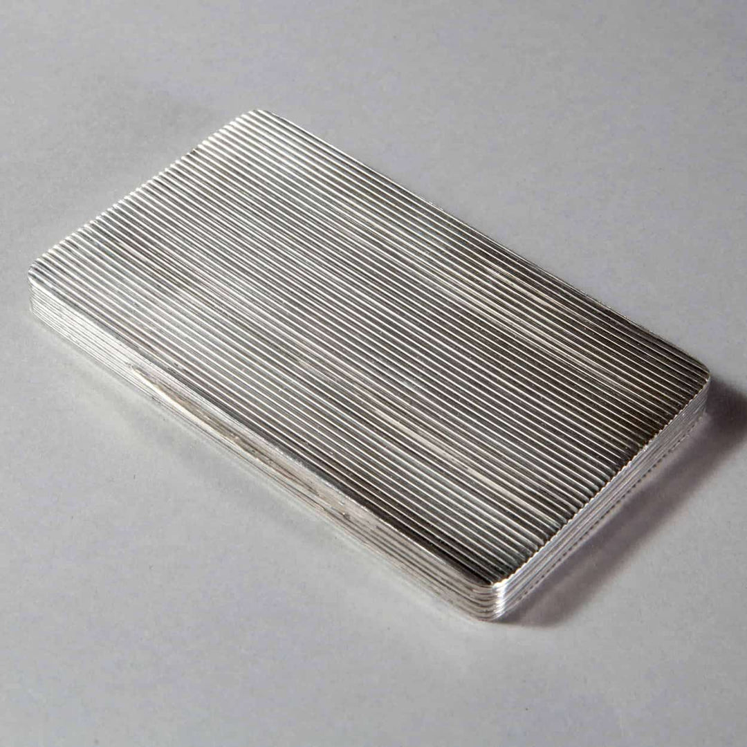 Mid 20th century Dunhill ribbed silver plate cigarette case by The Sold Archive, elegant fluted design on display