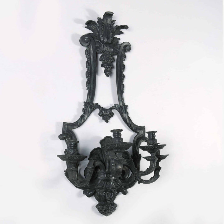 Louis XIV style bronze four light wall applique by Collection TH10 with intricate antique design details