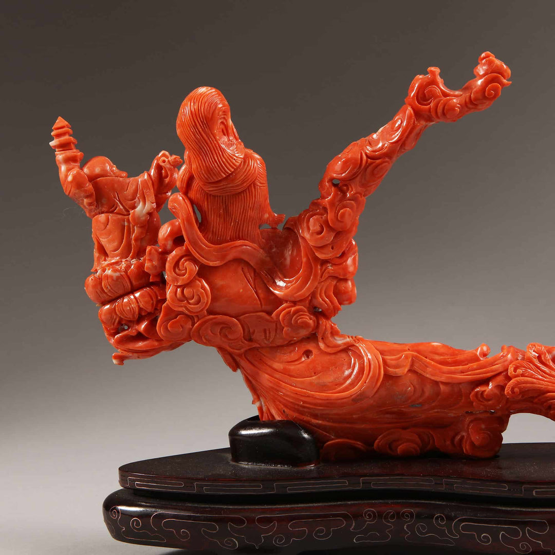 Chinese carved precious coral reclining Guanyin figure with attendants by Nwtiques detailed craftsmanship