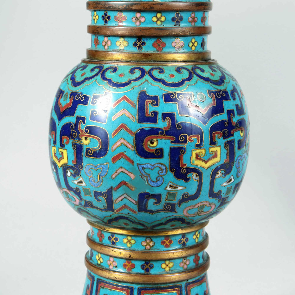Close-up of 19th century Qing Dynasty blue cloisonne Gu vase with intricate enamel patterns by Nwtiques