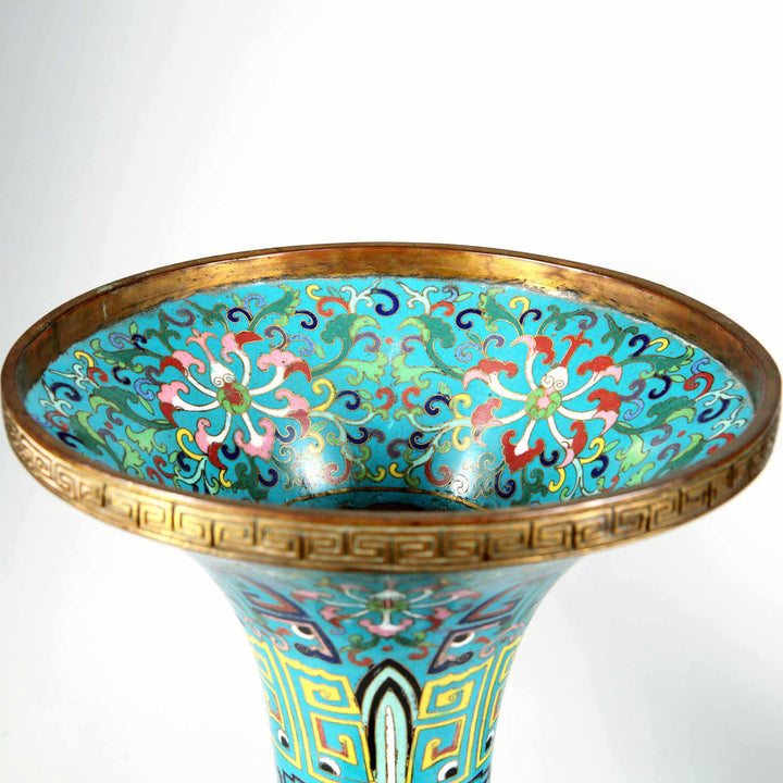 Close-up of 19th century Qing Dynasty blue cloisonne Gu vase with floral patterns from Nwtiques