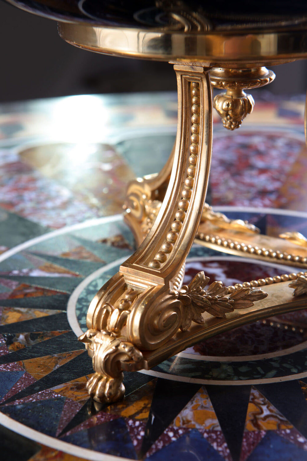 Close-up of ornate gilt stand supporting large Chinese green jade bowl from Nwtiques