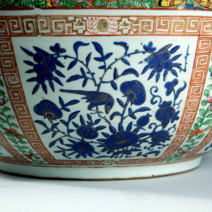 Close-up of Nwtiques 19th century Chinese export porcelain bowl with blue floral and bird design panel