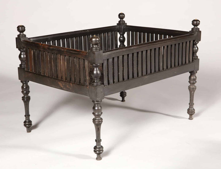Solid ebony Anglo Indian dog bed with turned legs and slatted raised basket, Collection EE20, circa 1850