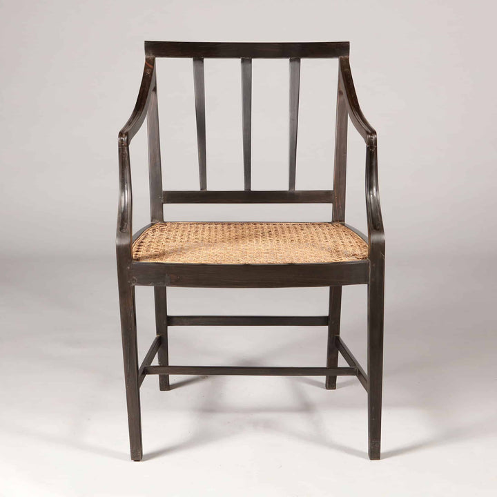 Solid ebony Anglo Indian dining chair with handwoven caned seat and spindle back from Collection EE30