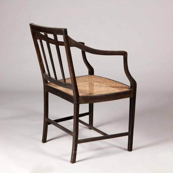 Solid ebony Anglo Indian dining chair with caned seat and spindle back from Collection EE30