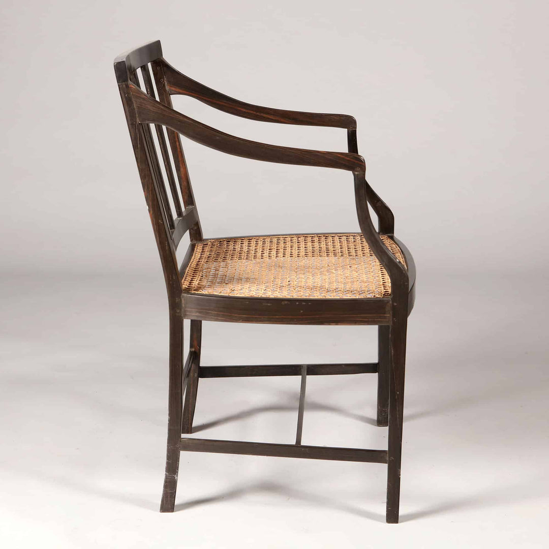 Solid ebony Anglo Indian dining chair with caned seat and elegant spindle back by Collection EE30