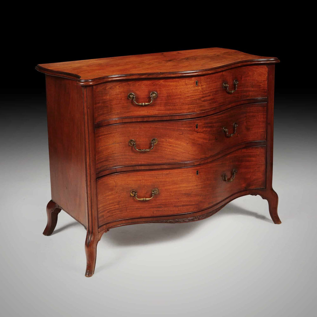 George III serpentine chest of drawers by Henry Hill of Marlborough in mahogany with brass handles Collection CK20