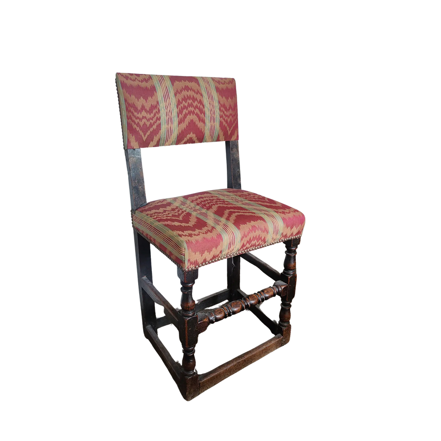 17th Century English oak hall chair with red patterned upholstery, turned legs, and stretchers by Nicholas Wells Antiques