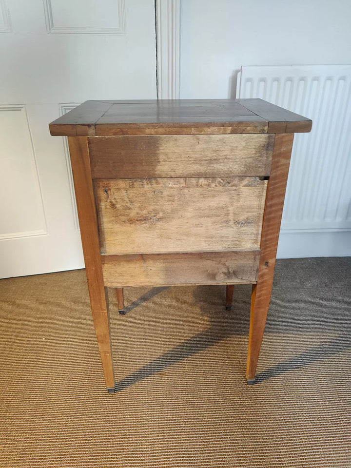 Side view of a 19th century walnut side cabinet with tapered legs by Nwtiques