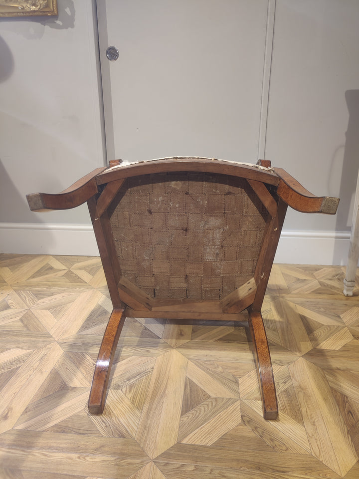 Underside view of a Baltic Biedermeier armchair from Collection CK40 showing wooden frame and woven seat base