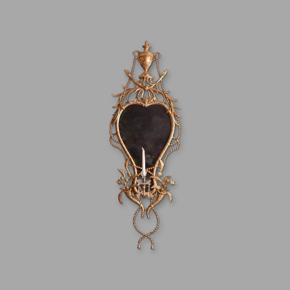 18th Century Gilt Carton-pierre Wall Mirror, on a plain mid-grey background.