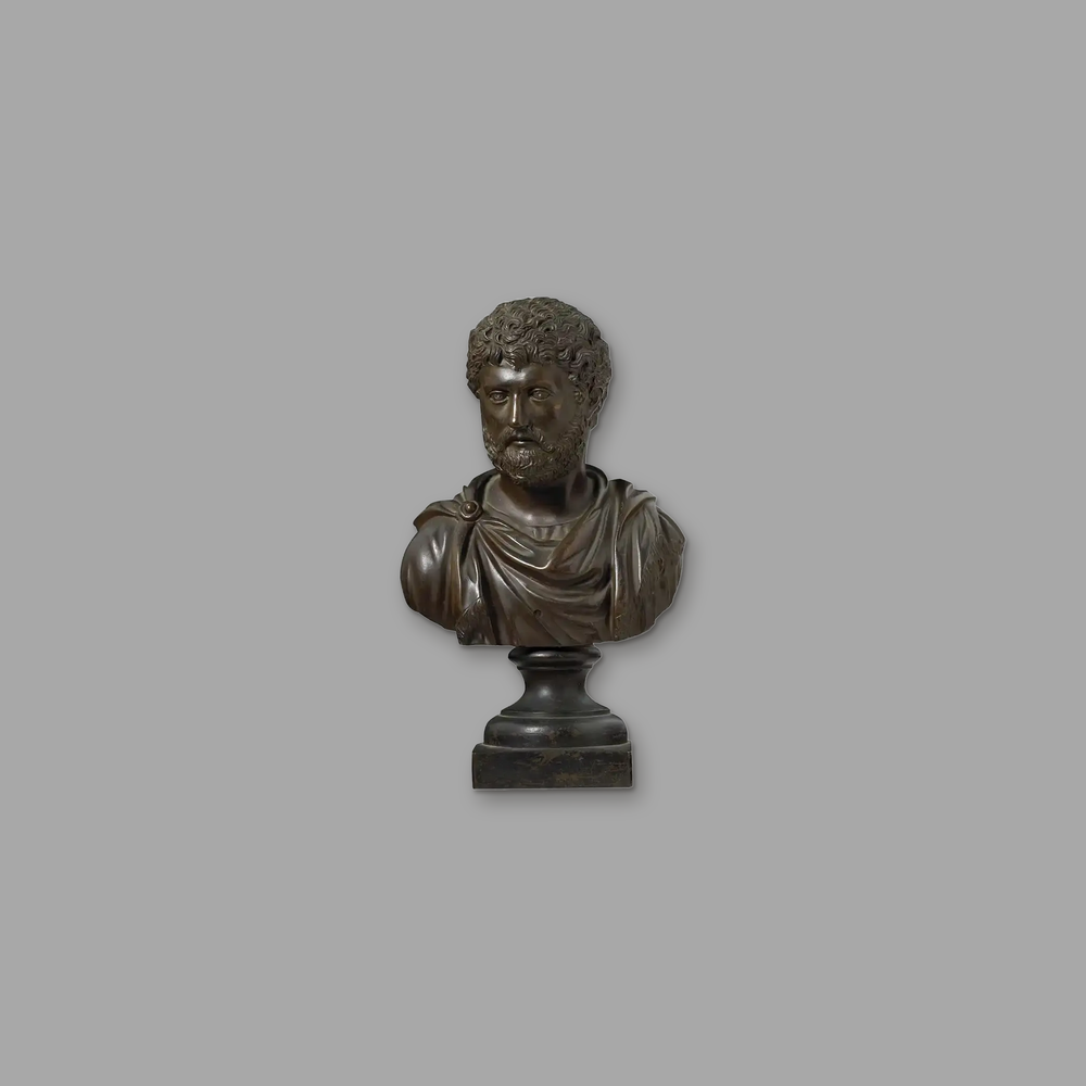 Late 18th Century Grand Tour Bronze Bust of Hadrian, on a plain mid-grey background.
